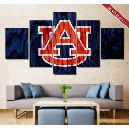 Five-piece wall art set with University Auburn Tigers logo on a wall with a couch and coffee table in a living room.
